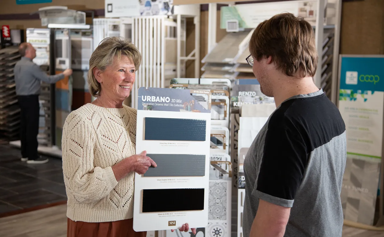 Carpet King salesperson helping customer